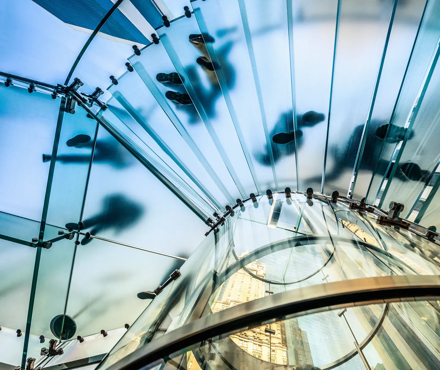 Image of a office stairway with employees.